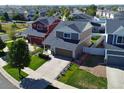 Aerial view of a neighborhood featuring well-maintained homes, green lawns, and tree-lined streets at 20768 Randolph Pl, Denver, CO 80249