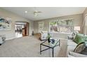 Inviting living area with archway, plush seating, and view of the open floor plan at 3570 E Arapahoe Pl, Centennial, CO 80122