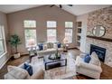 Comfortable living room with a fireplace, natural light and neutral color palette at 5597 S Buchanan St, Aurora, CO 80016