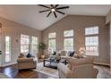 Bright living room with large windows, plush seating, and ample natural light at 5597 S Buchanan St, Aurora, CO 80016