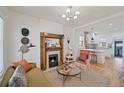 Inviting living room with a decorative fireplace and an open layout to the kitchen at 288 S Sherman St, Denver, CO 80209