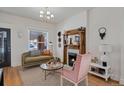 Cozy living room with a charming fireplace and stylish decor with natural light at 288 S Sherman St, Denver, CO 80209