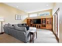 Comfortable living room with a gray couch and a built-in wooden media center at 19640 Four Winds Way, Monument, CO 80132