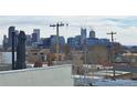 Stunning city skyline view, featuring skyscrapers and modern buildings in the distance at 1930 W 35Th Ave, Denver, CO 80211