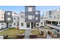 Contemporary home featuring an eye-catching facade, green lawn, and tidy landscaping at 1930 W 35Th Ave, Denver, CO 80211