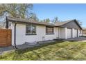 Charming single story home with a well maintained lawn and painted brick exterior at 5780 W 5Th Ave, Lakewood, CO 80226