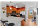 Cozy kitchen with stainless steel appliances, quartz countertop island, and decorative backsplash at 7828 W 54Th Ave, Arvada, CO 80002