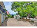 Backyard view of detached shed and brick walls along the driveway at 8300 W 67Th Ave, Arvada, CO 80004