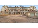 Townhome community with multiple units and parking at 431 Black Feather Loop # 817, Castle Rock, CO 80104