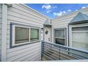 Charming condo entrance with a welcoming door, unit number, and fresh blue and white exterior at 1226 S Monaco Pkwy # 308, Denver, CO 80224