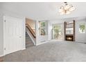Bright living room with a cozy fireplace and soaring ceilings at 2238 S Nile Ct, Aurora, CO 80014