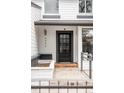 Close-up of a black front door with nine glass panes and house number at 4362 Peach Ct, Boulder, CO 80301