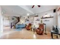 Spacious living room with hardwood floors, modern furniture, and decor at 6430 Silver Mesa Dr # D, Highlands Ranch, CO 80130