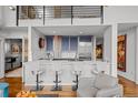 Open concept kitchen with stainless steel appliances and breakfast bar seating at 1050 Cherokee St # 403, Denver, CO 80204