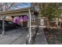 Charming home exterior with convenient carport, sidewalk, and landscaping, offering a welcoming curb appeal at 709 Arrow Ct, Lafayette, CO 80026