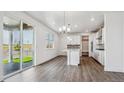 Bright dining area with a sliding glass door that leads to the backyard at 1876 Chaffee Crest Dr, Berthoud, CO 80513