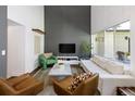 Bright living room with a decorative fireplace, hardwood floors, modern furniture, and lots of natural light at 505 Detroit St, Denver, CO 80206