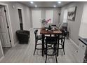 Cozy living room featuring gray paint and vinyl floors, perfect for entertaining at 4673 Sherman St, Denver, CO 80216