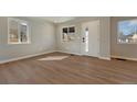 Bright and airy living room featuring modern floors and ample natural light at 1328 Holly St, Denver, CO 80220
