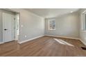 Spacious living room features modern flooring and a neutral color palette at 1328 Holly St, Denver, CO 80220