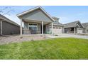 Charming home with a well-manicured lawn, a covered porch and an attached two car garage at 331 Josef Cir, Fort Lupton, CO 80621