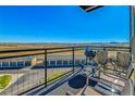 Enjoy beautiful views from this spacious balcony with plenty of room for outdoor dining and relaxation at 13598 Via Varra # 301, Broomfield, CO 80020