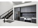 Stylish kitchen features stainless steel appliances and white countertop at 1601 Park Ave # 110, Denver, CO 80218