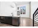 Contemporary kitchen boasts modern appliances and abundant natural light at 1601 Park Ave # 110, Denver, CO 80218