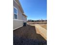 View of the new home construction, featuring a spacious backyard with new sod and proximity to a community park at 16602 E 109Th Ave, Commerce City, CO 80022