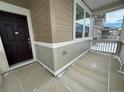 Dark brown front door with sidelights leading into the home at 16602 E 109Th Ave, Commerce City, CO 80022