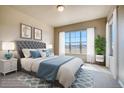 Bright bedroom with plush bed and large windows offering natural light at 841 W 128Th Pl, Westminster, CO 80234