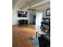 Bright living room featuring ceiling fan, wood floors, and a neutral color palette at 9995 E Harvard Ave # 177, Denver, CO 80231