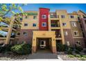 Three-story condo building with brick accents and an inviting entrance at 1144 Rockhurst Dr # 105, Highlands Ranch, CO 80129