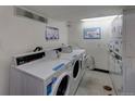 Well-equipped laundry room featuring multiple washing machines, coin and mobile payment options, and convenience at 1300 S Parker Rd # 110, Denver, CO 80231