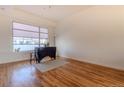 Bright living room with hardwood floors, large window, and modern decor at 722 W 6Th Ave, Denver, CO 80204