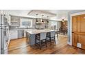 Bright kitchen featuring a large island with seating, stainless appliances, and breakfast nook at 5537 Lake Gulch Rd, Castle Rock, CO 80104