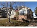 Charming home with manicured front yard and attached two car garage at 1128 S Duquesne Cir, Aurora, CO 80018