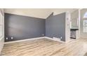 Open-concept living room featuring wood floors and neutral paint colors at 6382 Freeport Dr, Highlands Ranch, CO 80130