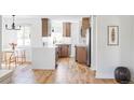 Modern kitchen with sleek cabinetry, quartz countertops, and stainless steel appliances at 1315 Holly St, Denver, CO 80220