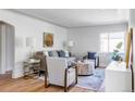 Light and airy living room with hardwood floors and ample natural light at 1315 Holly St, Denver, CO 80220