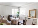 Bright living room featuring a neutral color palette and stylish furniture at 1315 Holly St, Denver, CO 80220