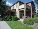 Inviting two-story home boasts a spacious balcony, covered porch, and lush landscaping at 8915 Federal Blvd # 104, Westminster, CO 80260