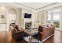 Living room featuring a fireplace, stylish seating, and scenic views from large windows at 5455 Landmark Pl # 1009, Greenwood Village, CO 80111