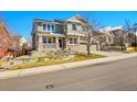 Charming two-story home with a brick facade and well-maintained landscaping on a quiet street at 3644 Sunchase Dr, Castle Rock, CO 80109