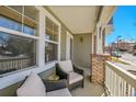 Comfortable front porch with seating, offering a relaxing outdoor space at 3644 Sunchase Dr, Castle Rock, CO 80109