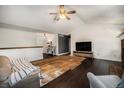 Living room features vaulted ceilings and transitions to an entry hall at 1572 W Long Ave, Littleton, CO 80120