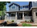 Charming front porch with a seating area, decorative plants, and stylish accents at 879 Quintana Ln, Erie, CO 80516