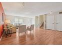 Bright living room featuring hardwood floors, neutral paint, and contemporary furniture creating an inviting atmosphere at 2173 S Ouray St, Aurora, CO 80013