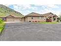 Long driveway leads to the attached garages, providing lots of parking at 5881 Deer Meadow Trl, Golden, CO 80403