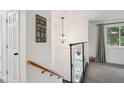 Bright entryway with a staircase and modern lighting fixtures at 2843 S Otis St, Denver, CO 80227